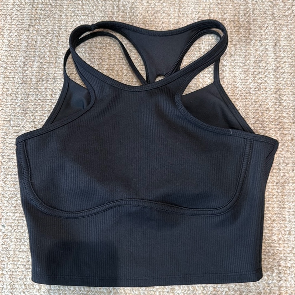 Alo tank top in black. Great for wearing alone or working out.
